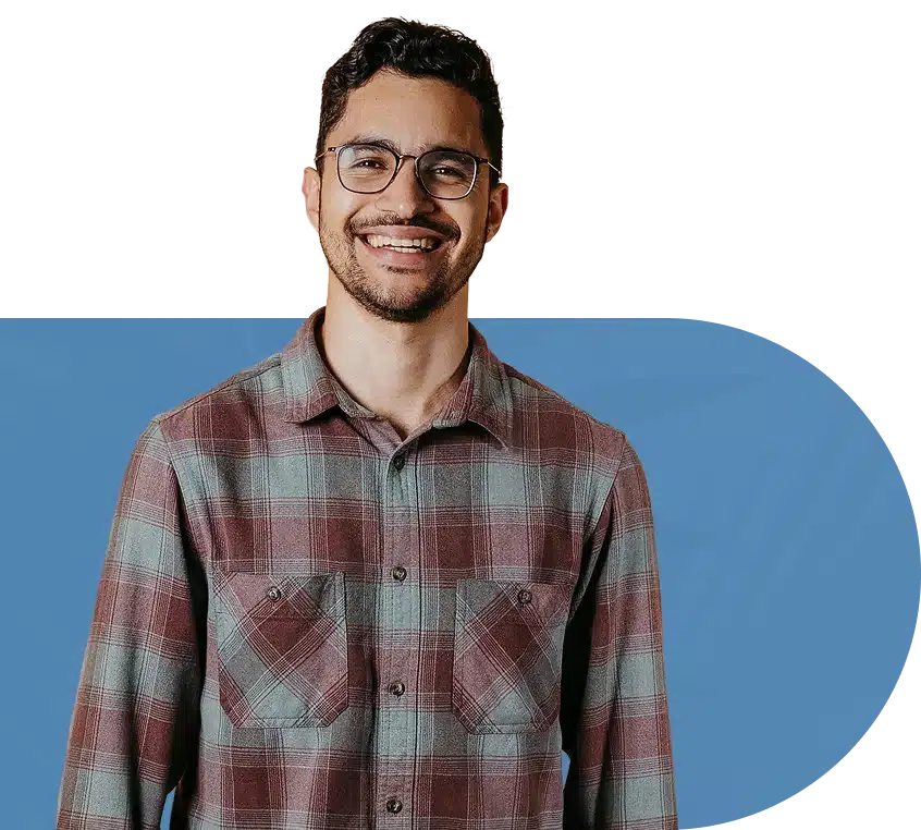 A smiling man with glasses.